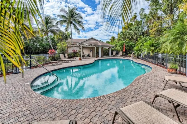 a view of a swimming pool with a patio