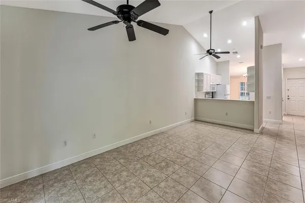 a view of a kitchen with a sink and a window