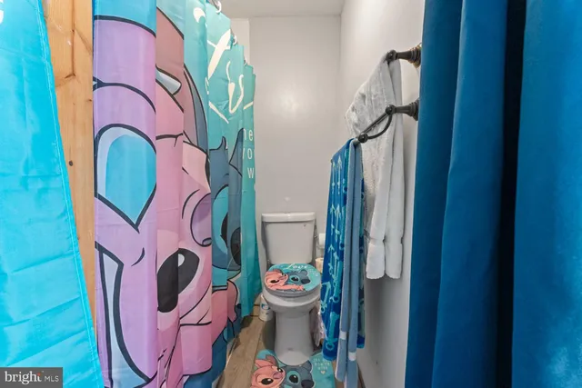 a bathroom with a toilet and a sink