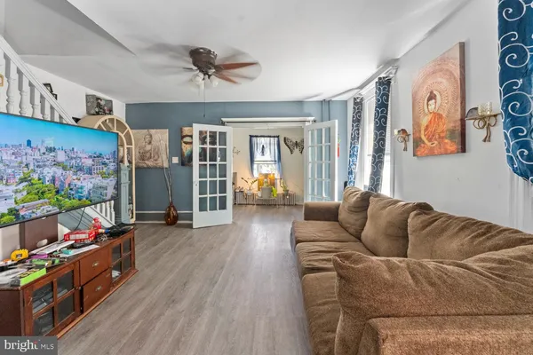a living room with furniture and a area