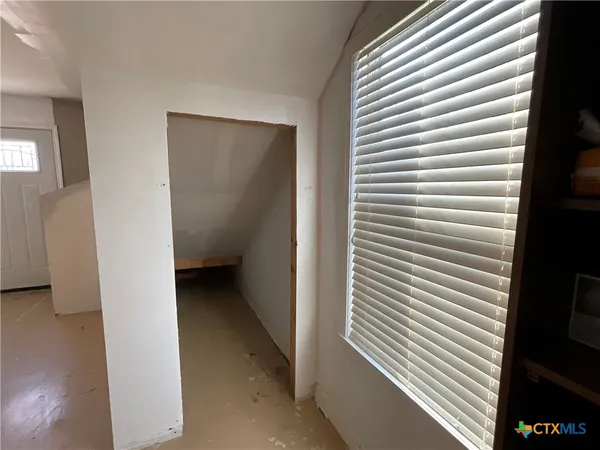 a view of entryway with stairs