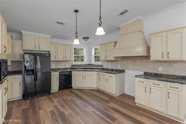 a kitchen with a sink stove and refrigerator