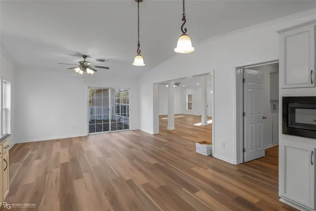 a view of storage and utility room with wooden floor