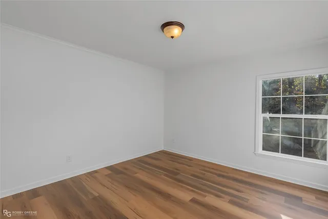 a spacious bathroom with a granite countertop sink and a mirror