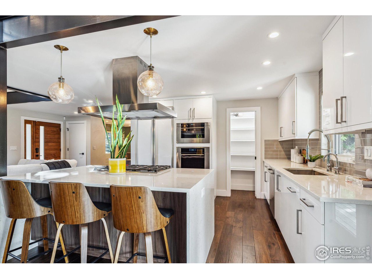 1920 Vista Drive Boulder, CO 80304 - Photo 11 of 38 a kitchen with kitchen island granite countertop a sink cabinets and stainless steel appliances