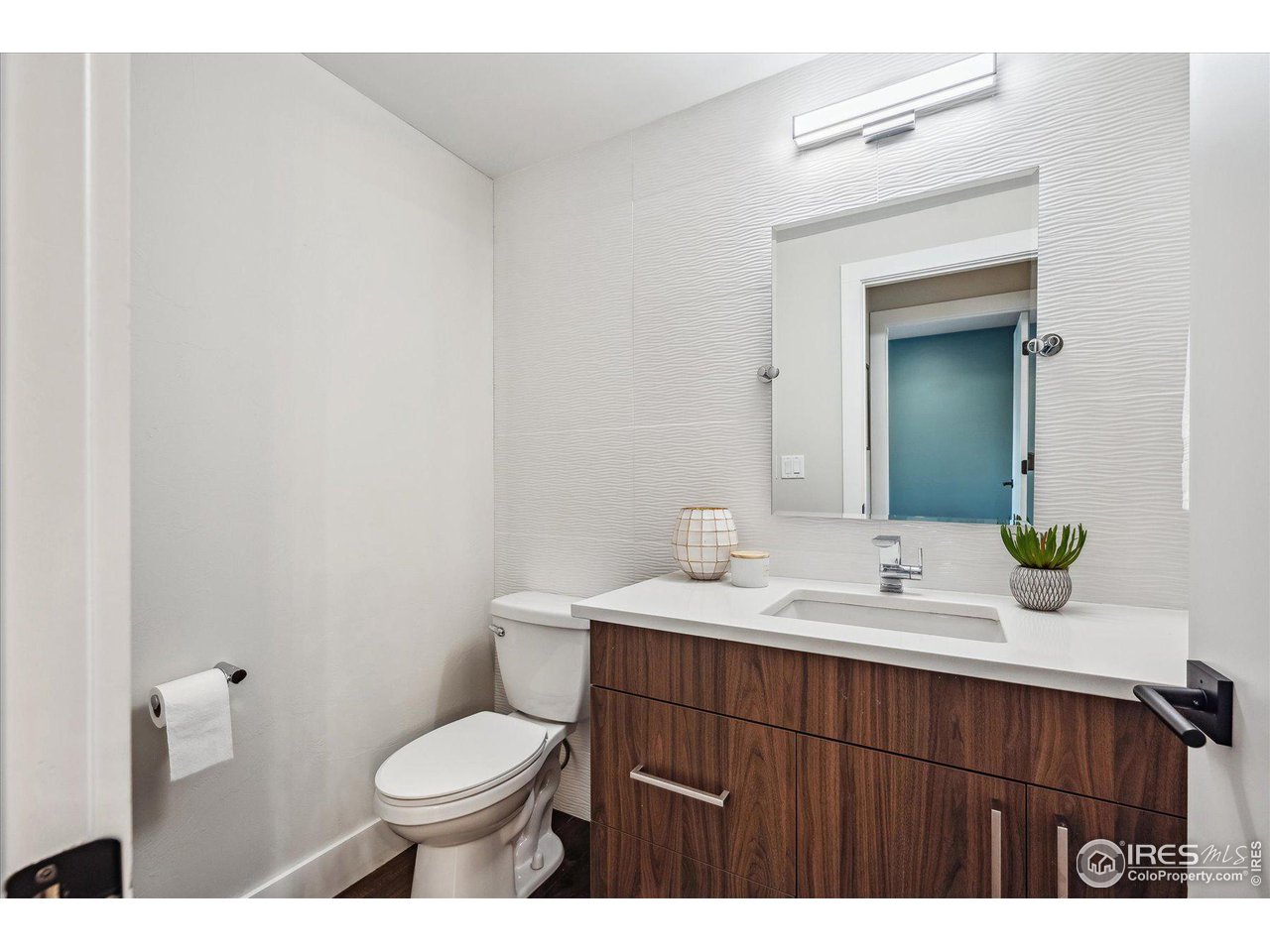 1920 Vista Drive Boulder, CO 80304 - Photo 16 of 38 a bathroom with a sink a toilet and mirror