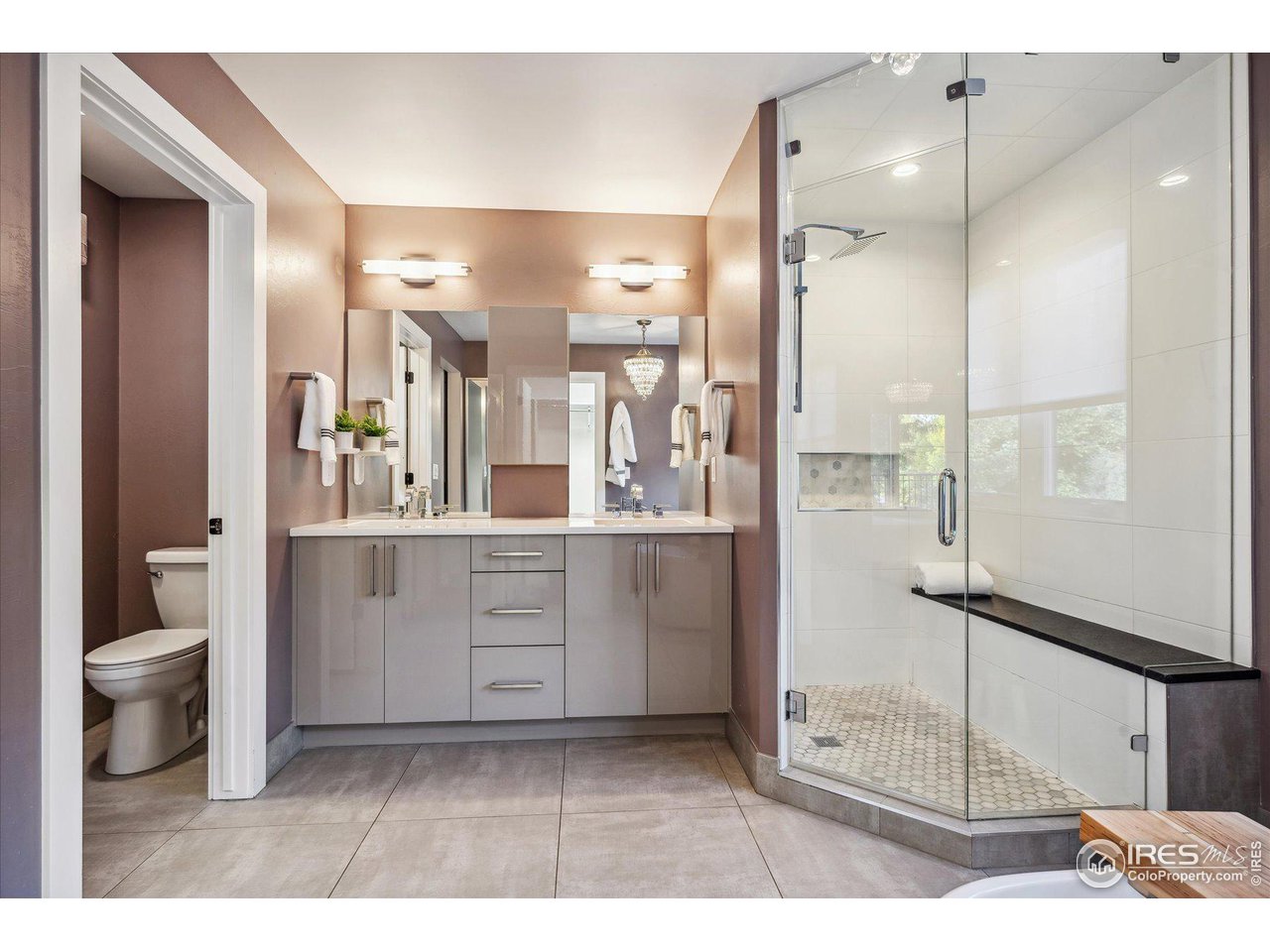 1920 Vista Drive Boulder, CO 80304 - Photo 21 of 38 a bathroom with a double vanity sink toilet and shower