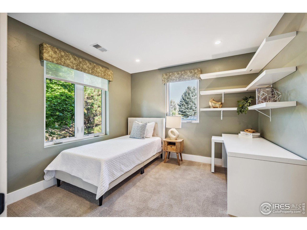 1920 Vista Drive Boulder, CO 80304 - Photo 23 of 38 a spacious bedroom with a bed and a window