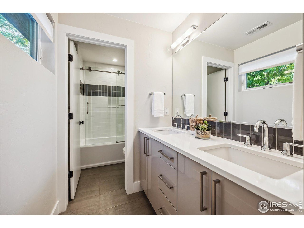 1920 Vista Drive Boulder, CO 80304 - Photo 25 of 38 a bathroom with a sink double vanity granite tub shower and a mirror