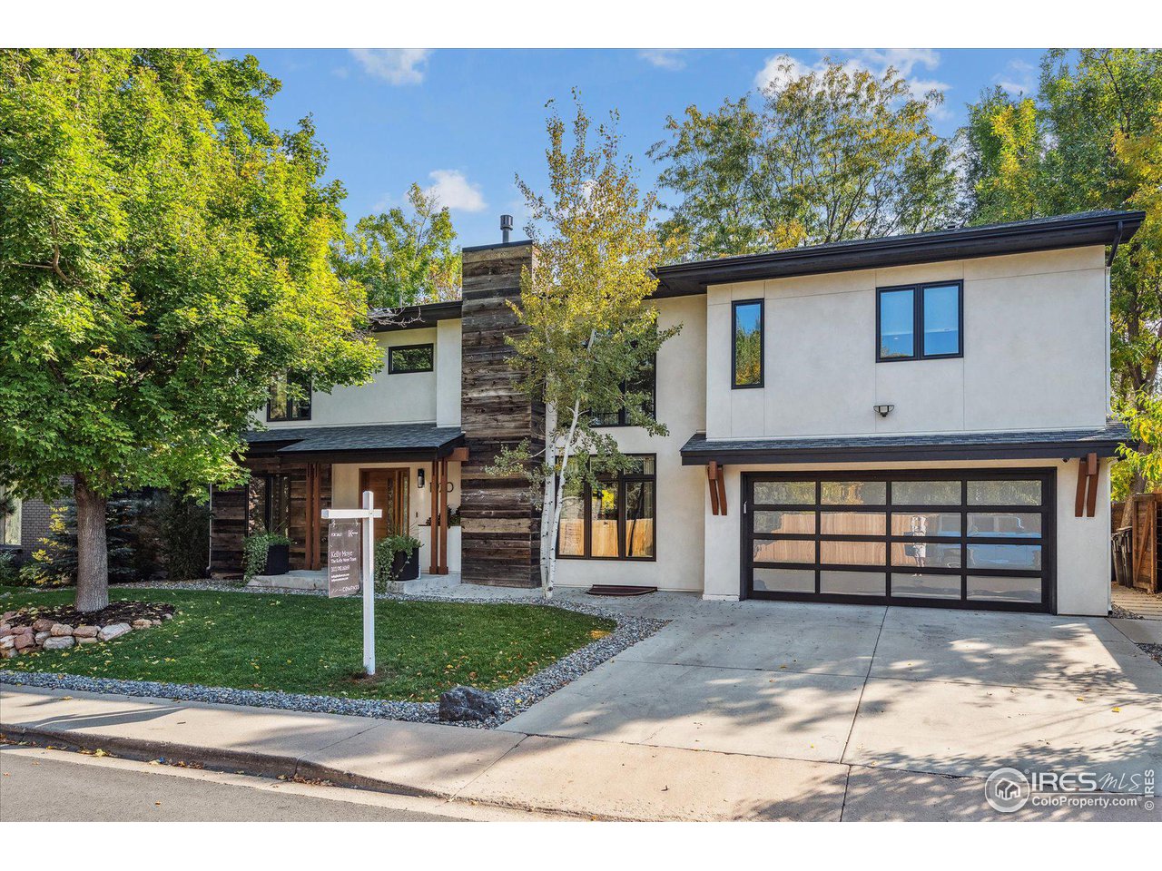1920 Vista Drive Boulder, CO 80304 - Photo 3 of 38 a front view of a house with a garden