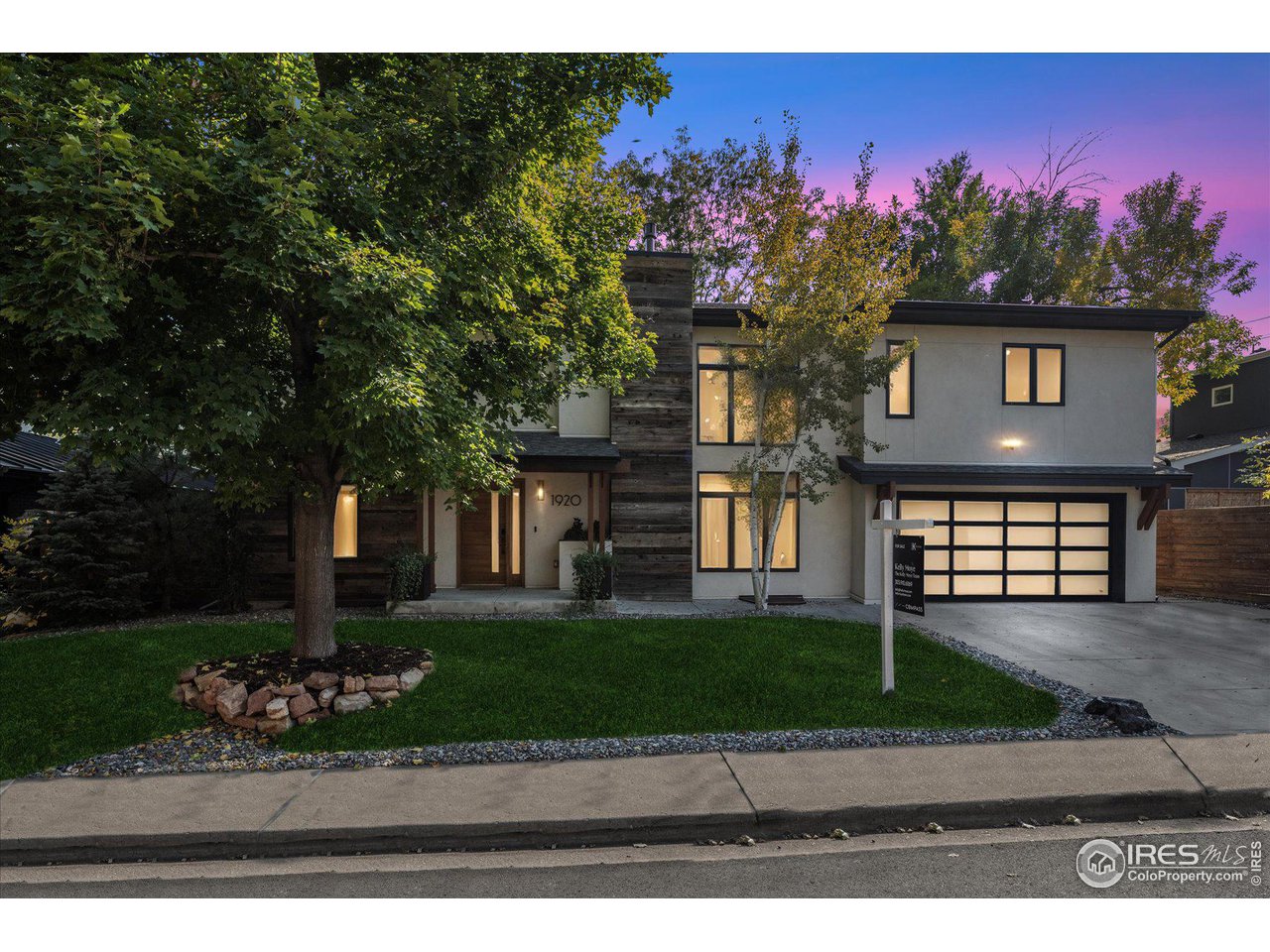 1920 Vista Drive Boulder, CO 80304 - Photo 38 of 38 a front view of a house with a yard and a garage