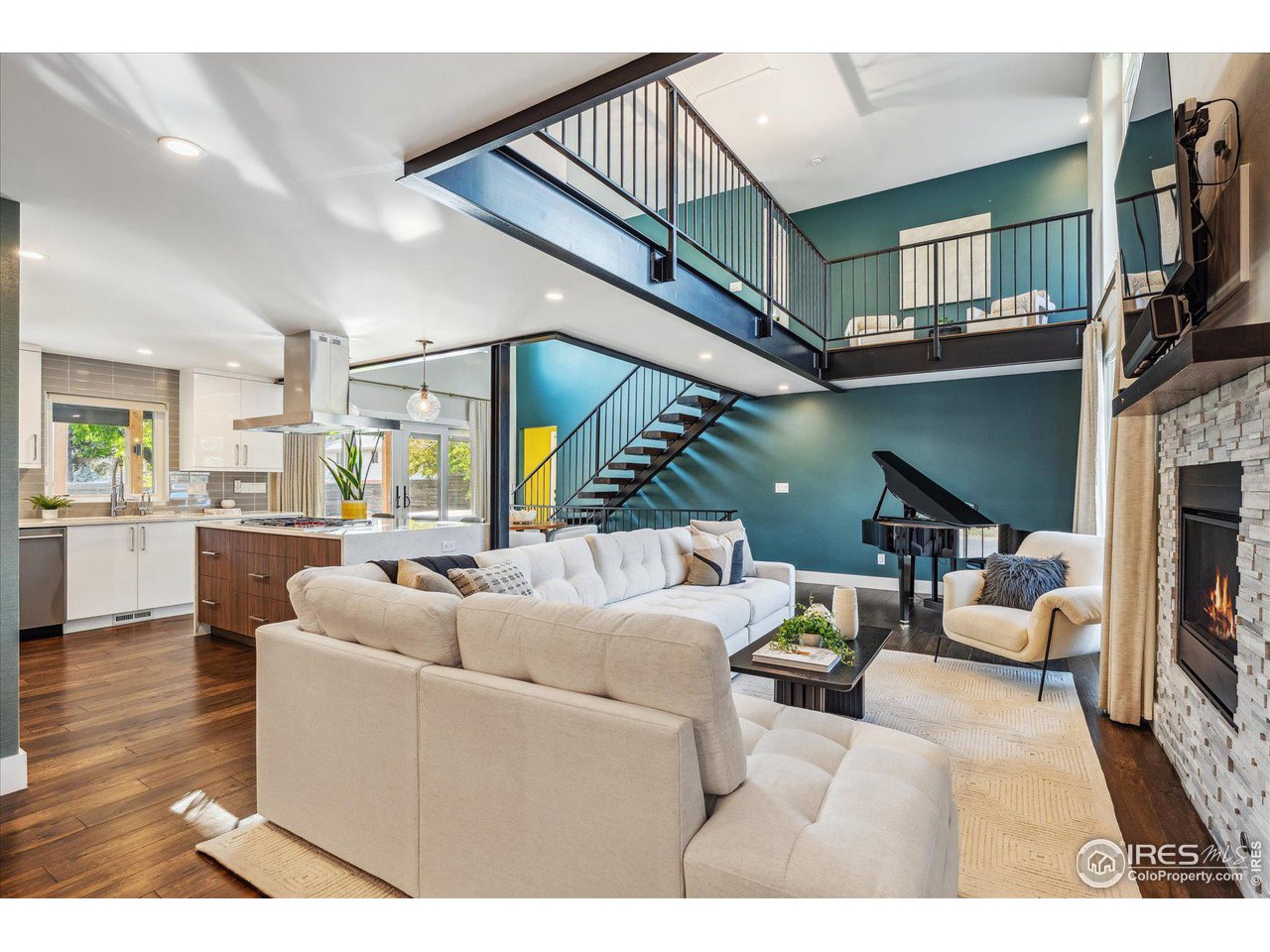 1920 Vista Drive Boulder, CO 80304 - Photo 6 of 38 a living room with furniture a flat screen tv and kitchen view