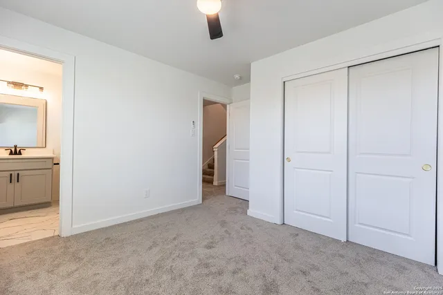 a view of an empty room and a window