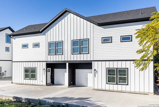 a front view of a house with a garage