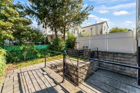 a view of a balcony with wooden floor