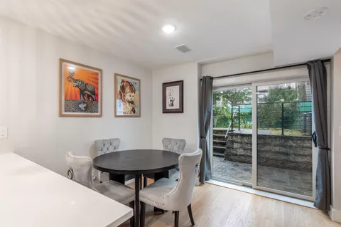 a view of a livingroom with furniture window and wooden floor