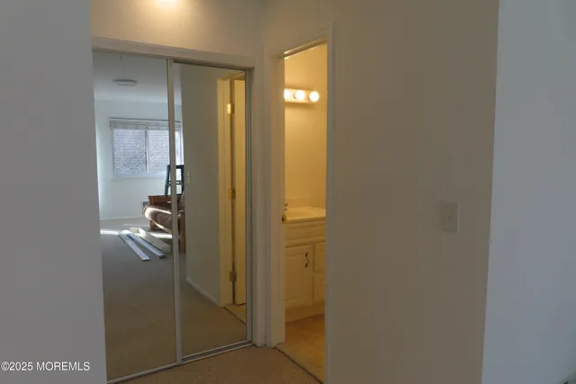 a bathroom with a glass shower door
