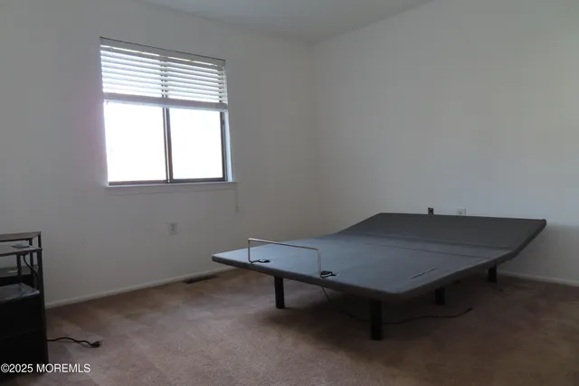 a room with a table and windows