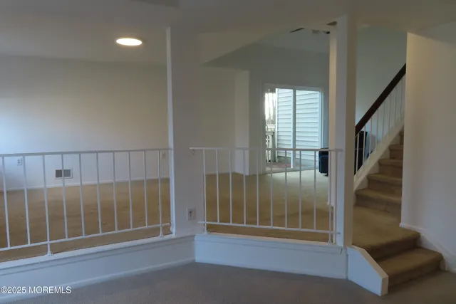 a view of entryway with a floor to ceiling window