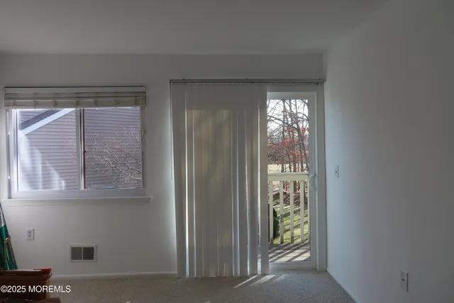 a view of hallway with windows