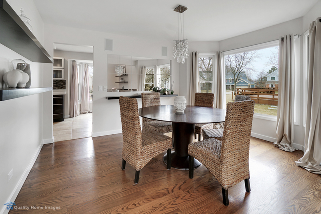 603 Raintree Road Buffalo Grove, IL 60089 - Photo 6 of 20 a view of a dining room with furniture window and wooden floor