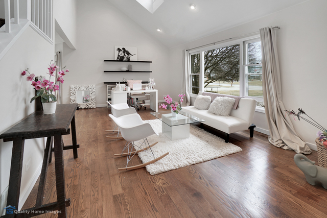 603 Raintree Road Buffalo Grove, IL 60089 - Photo 7 of 20 a living room with furniture and a large window