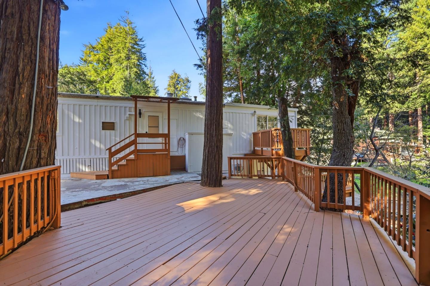 265 Brown Gables Road, Unit 11 Ben Lomond, CA 95005 - Photo 35 of 50 a view of a balcony with wooden floor and outdoor seating