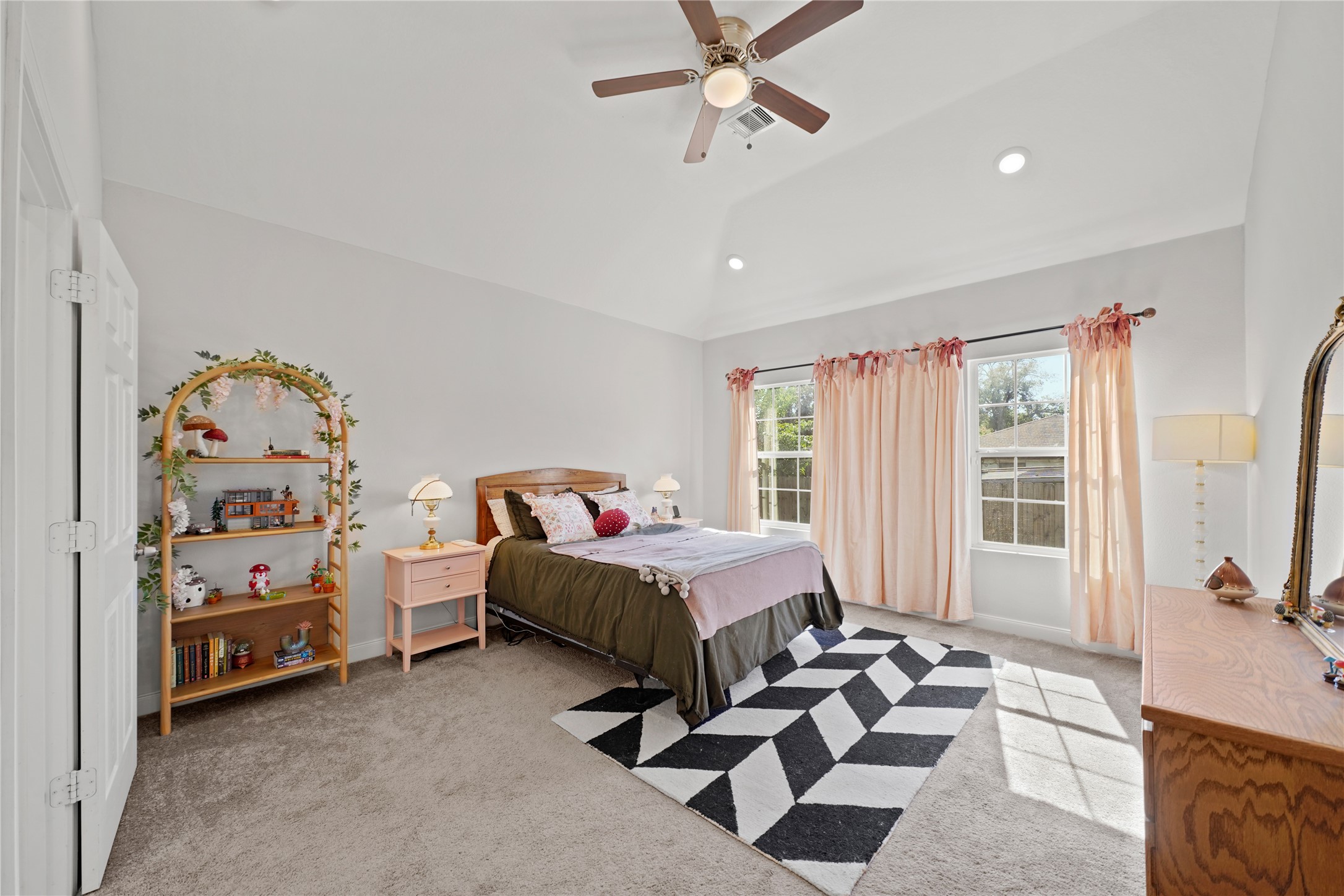 5602 Belmark Street Houston, TX 77033 - Photo 15 of 27 a bedroom with furniture and a large window