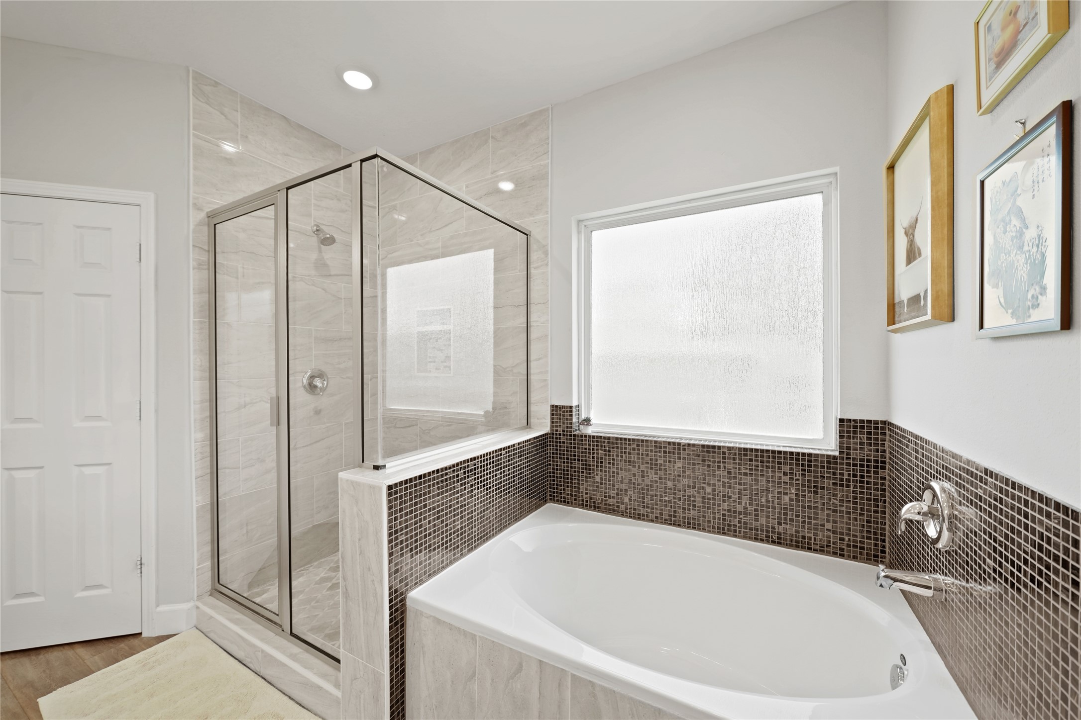 5602 Belmark Street Houston, TX 77033 - Photo 18 of 27 a bathroom with a bathtub and a shower