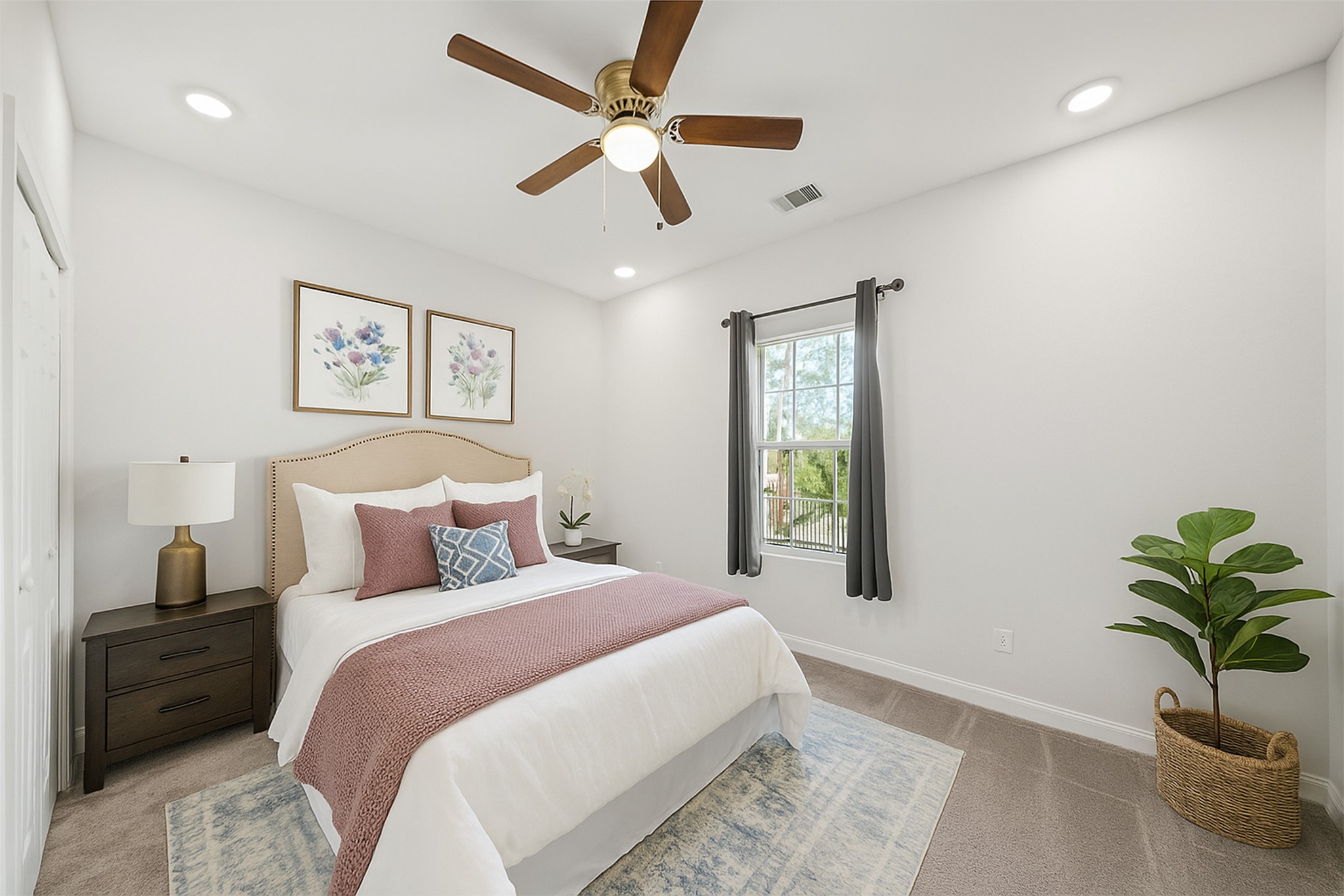 5602 Belmark Street Houston, TX 77033 - Photo 20 of 27 a bedroom with a large bed and a potted plant