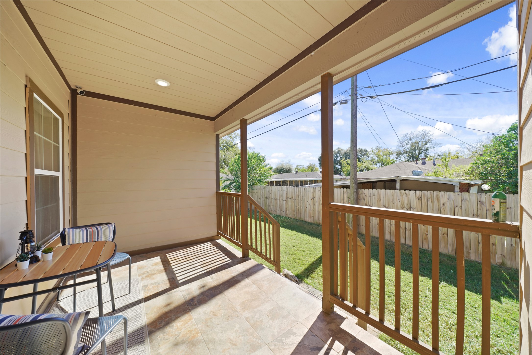 5602 Belmark Street Houston, TX 77033 - Photo 24 of 27 a view of a porch with furniture and a gate