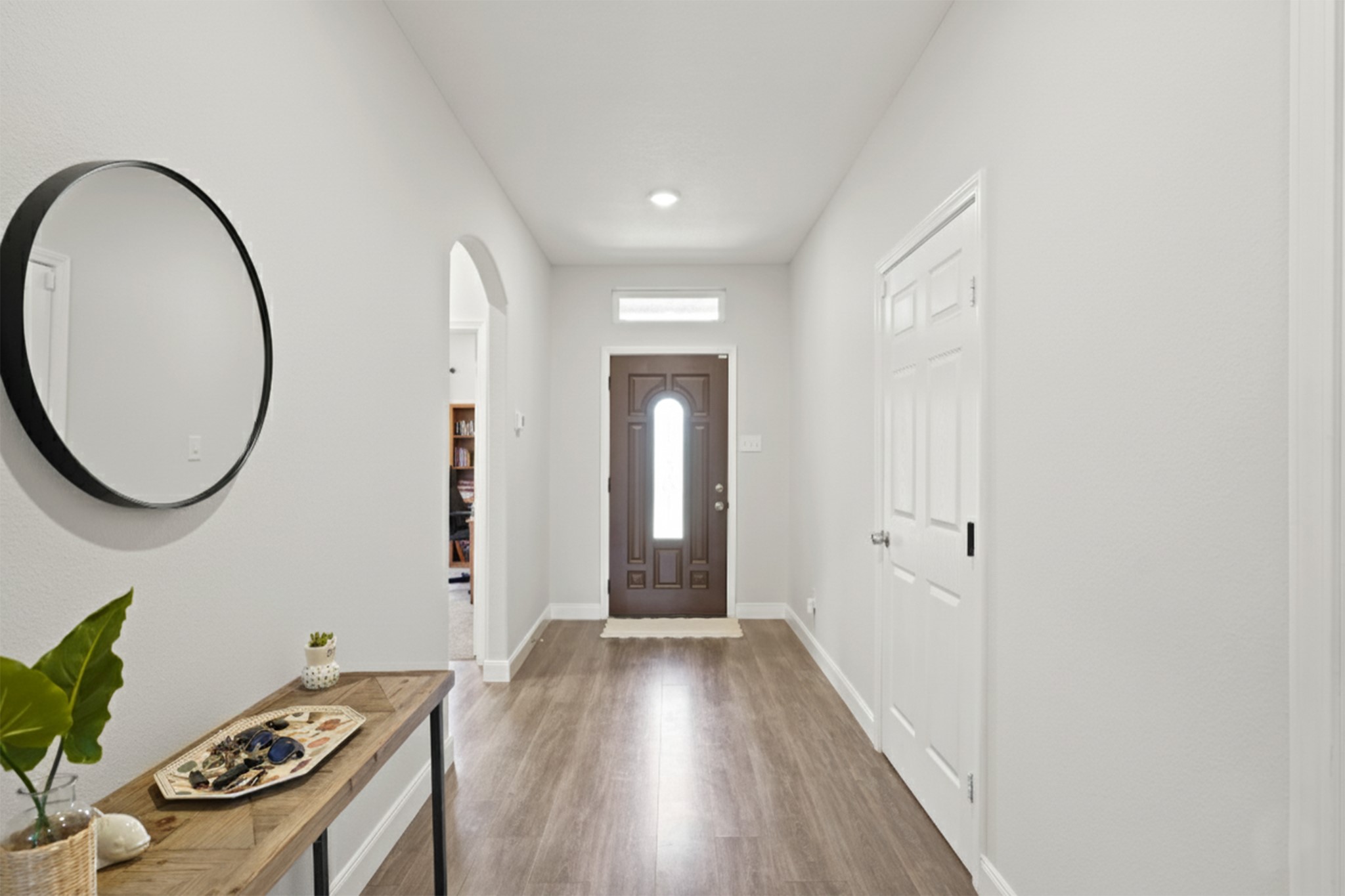 5602 Belmark Street Houston, TX 77033 - Photo 4 of 27 a view of a room with wooden floor furniture and a window