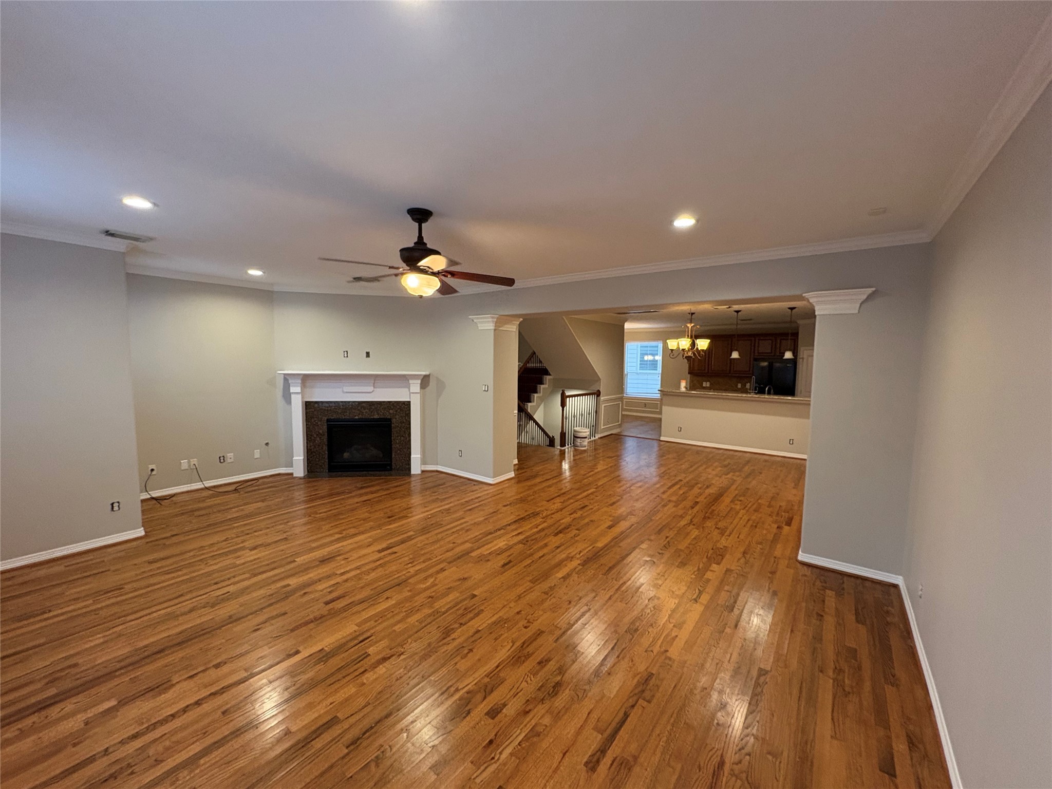 2614 Enclave At Shady Acres Court Houston, TX 77008 - Photo 6 of 15 an empty room with wooden floor and fireplace