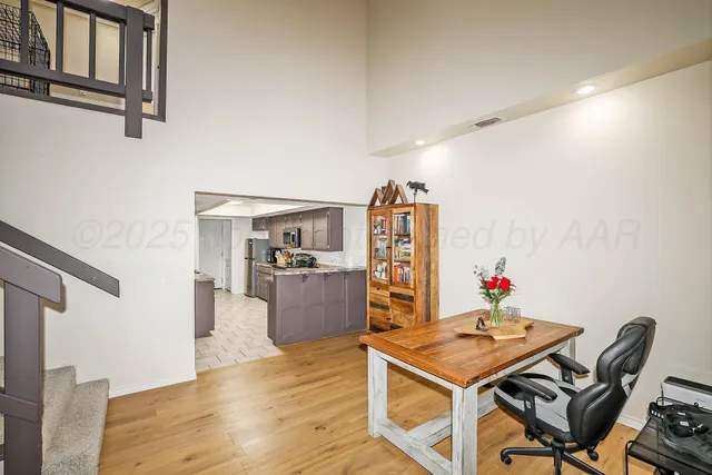 a room with furniture and a kitchen