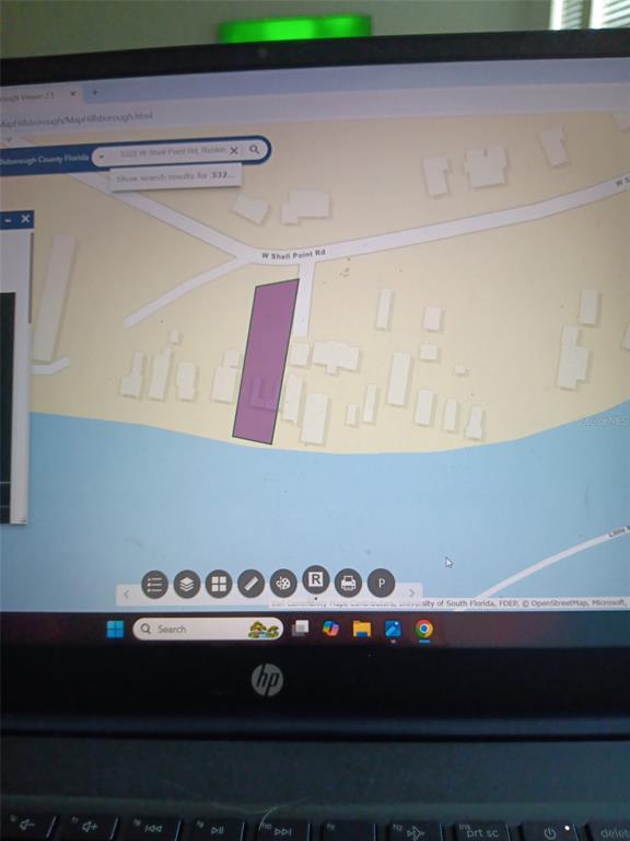 3322 West Shell Point Road, Unit B Ruskin, FL 33570 - Photo 13 of 13 a view of room with microwave and shelf