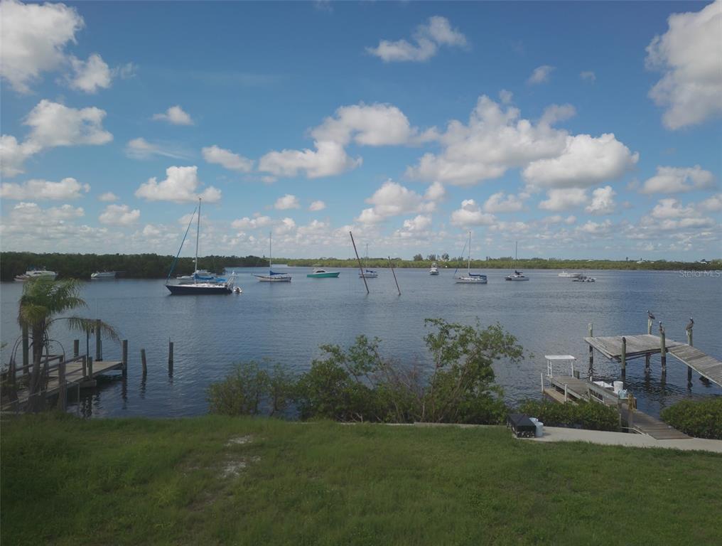 3322 West Shell Point Road, Unit B Ruskin, FL 33570 - Photo 9 of 13 a view of a lake with houses in the back