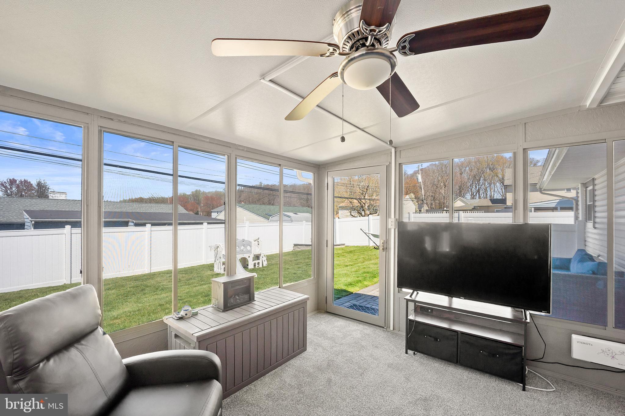 837 Fairfield Road Fairless Hills, PA 19030 - Photo 24 of 31 a living room with furniture tv and a floor to ceiling window