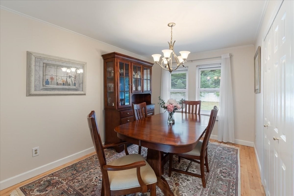 12 Bay Path Kingston, MA 02364 - Photo 12 of 24 a view of a dining room with furniture and chandelier