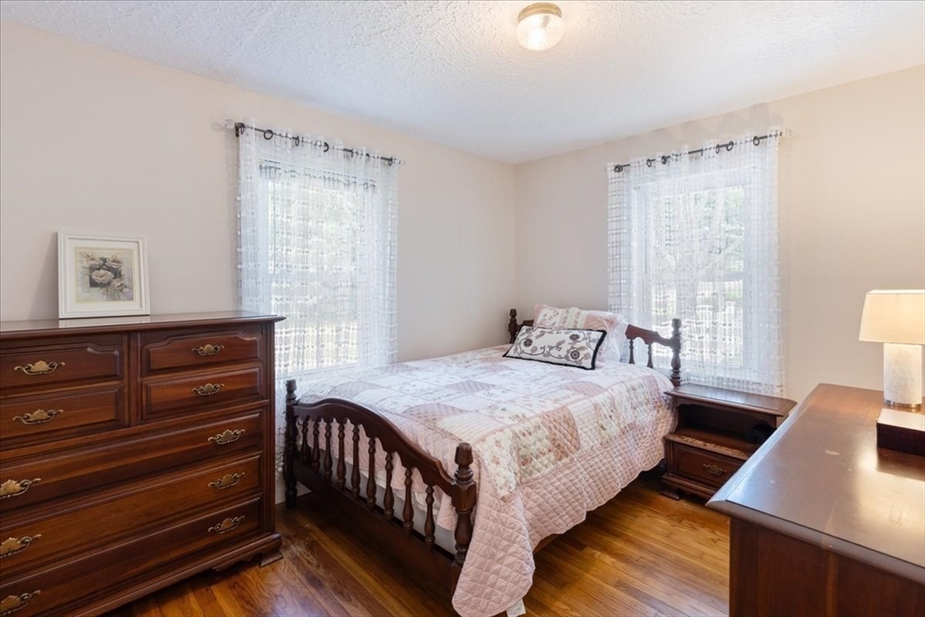 12 Bay Path Kingston, MA 02364 - Photo 14 of 24 a bedroom with a bed and window