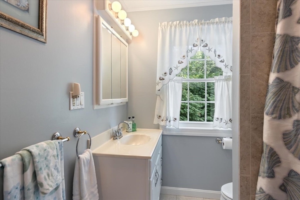 12 Bay Path Kingston, MA 02364 - Photo 15 of 24 a bathroom with a granite countertop sink and a mirror