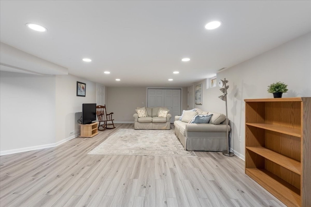 12 Bay Path Kingston, MA 02364 - Photo 16 of 24 a living room with furniture and a wooden floor