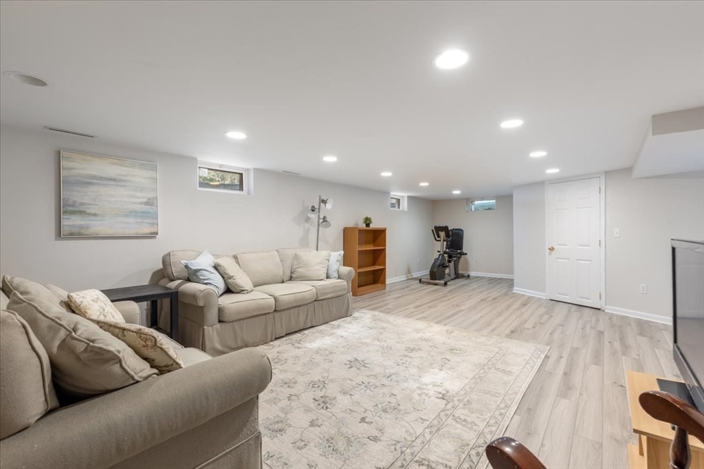 12 Bay Path Kingston, MA 02364 - Photo 17 of 24 a living room with furniture and a flat screen tv