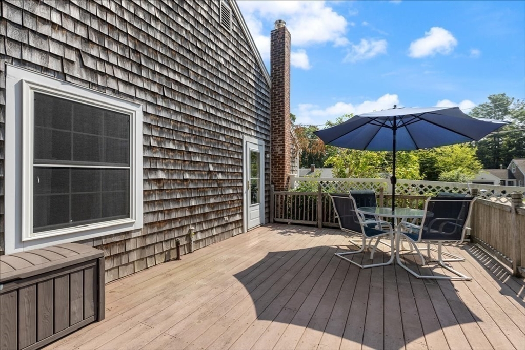 12 Bay Path Kingston, MA 02364 - Photo 21 of 24 a view of a backyard with a patio and wooden floor