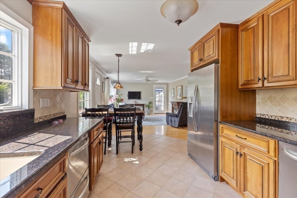 12 Bay Path Kingston, MA 02364 - Photo 3 of 24 a kitchen with stainless steel appliances granite countertop a stove a sink and a refrigerator