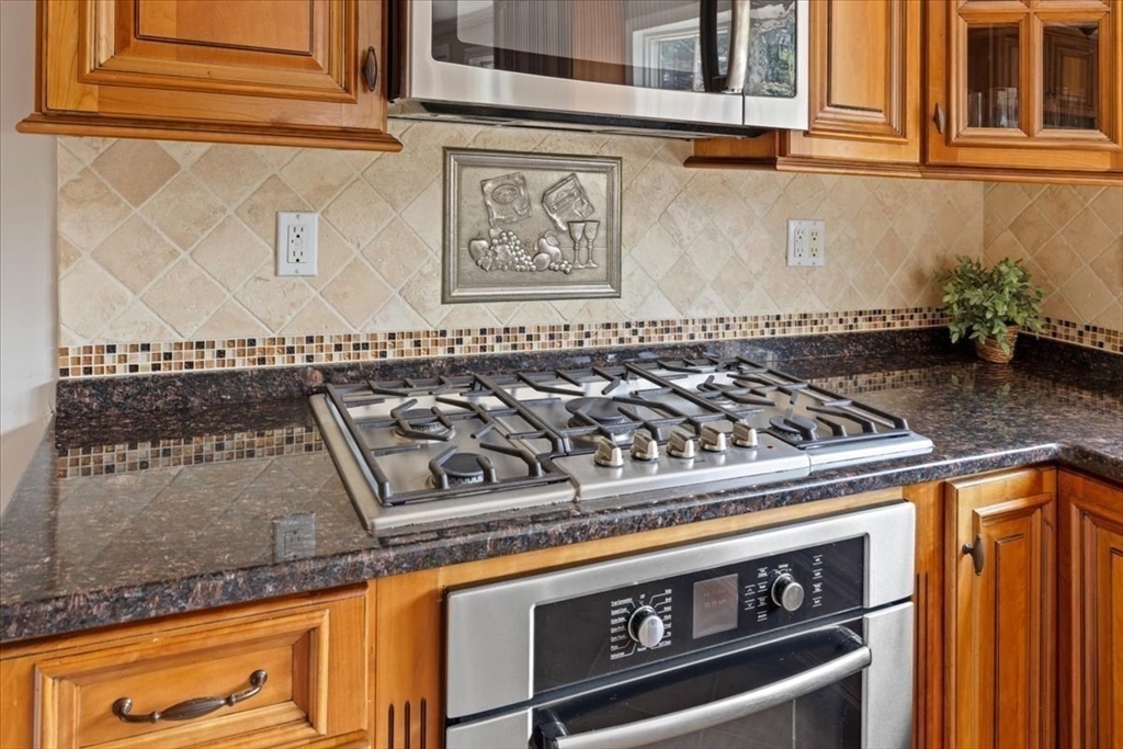 12 Bay Path Kingston, MA 02364 - Photo 6 of 24 a close view of a stove top oven