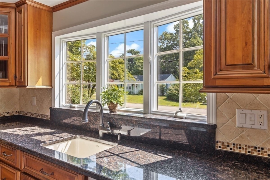 12 Bay Path Kingston, MA 02364 - Photo 7 of 24 a bathroom with a granite countertop sink and a window