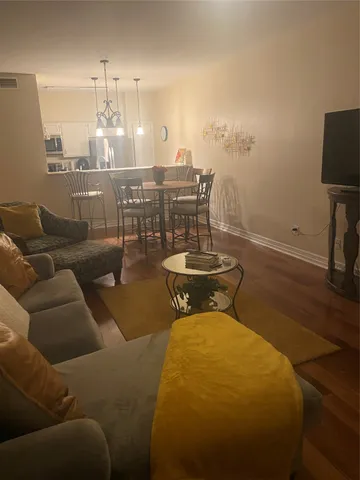 a view of a livingroom with furniture and chandelier