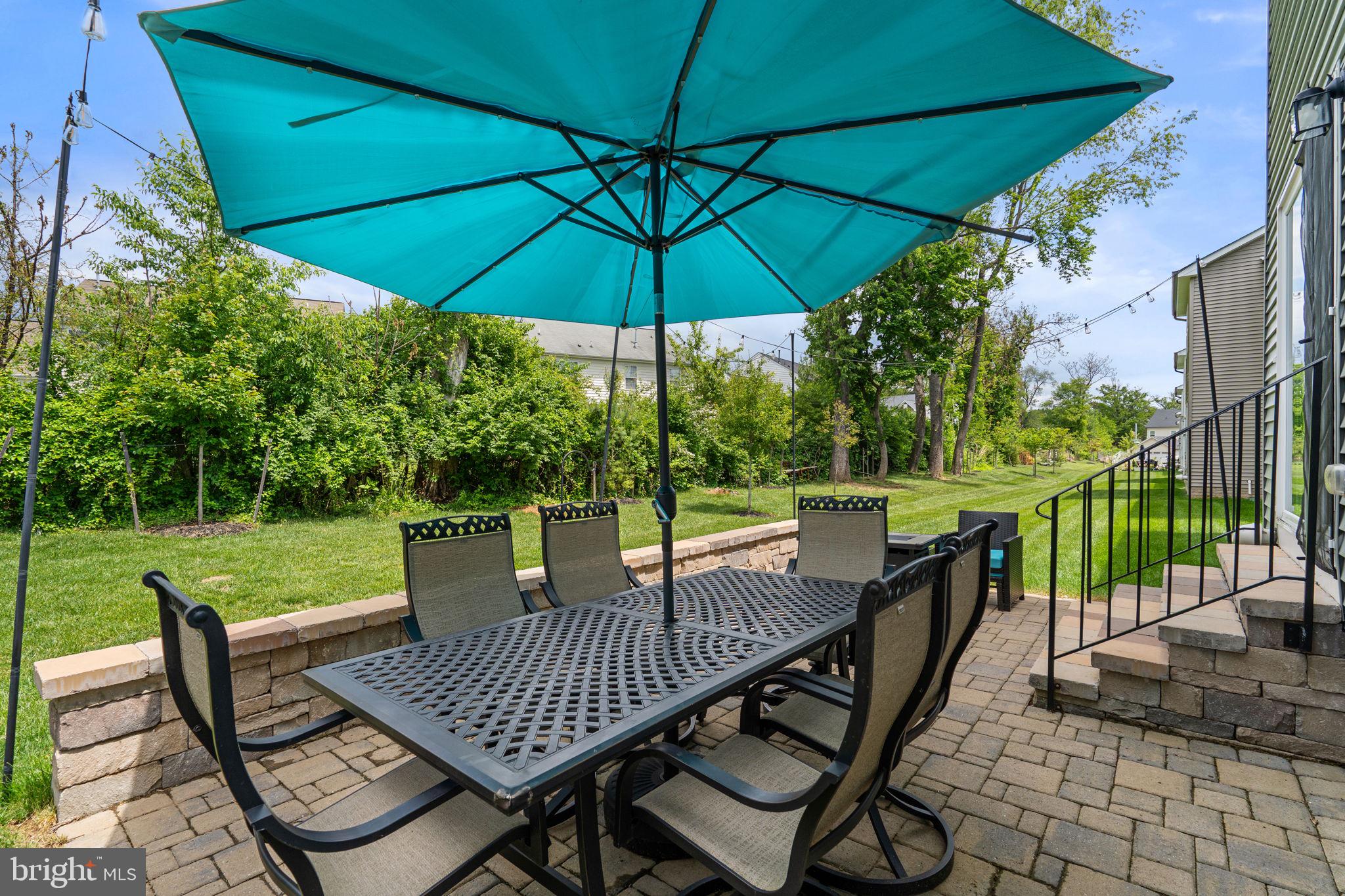 1713 Aurora Way Frederick, MD 21702 - Photo 53 of 57 a view of a patio with a table chairs and a umbrella