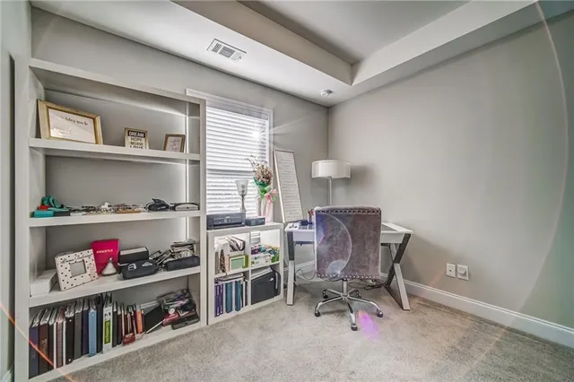 a view of a workspace with furniture