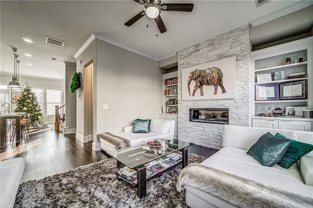 a living room with furniture and a fireplace